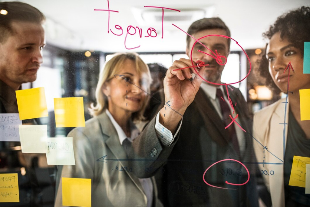 businesspeople-planning-on-a-glass-wall_53876-13586.jpg